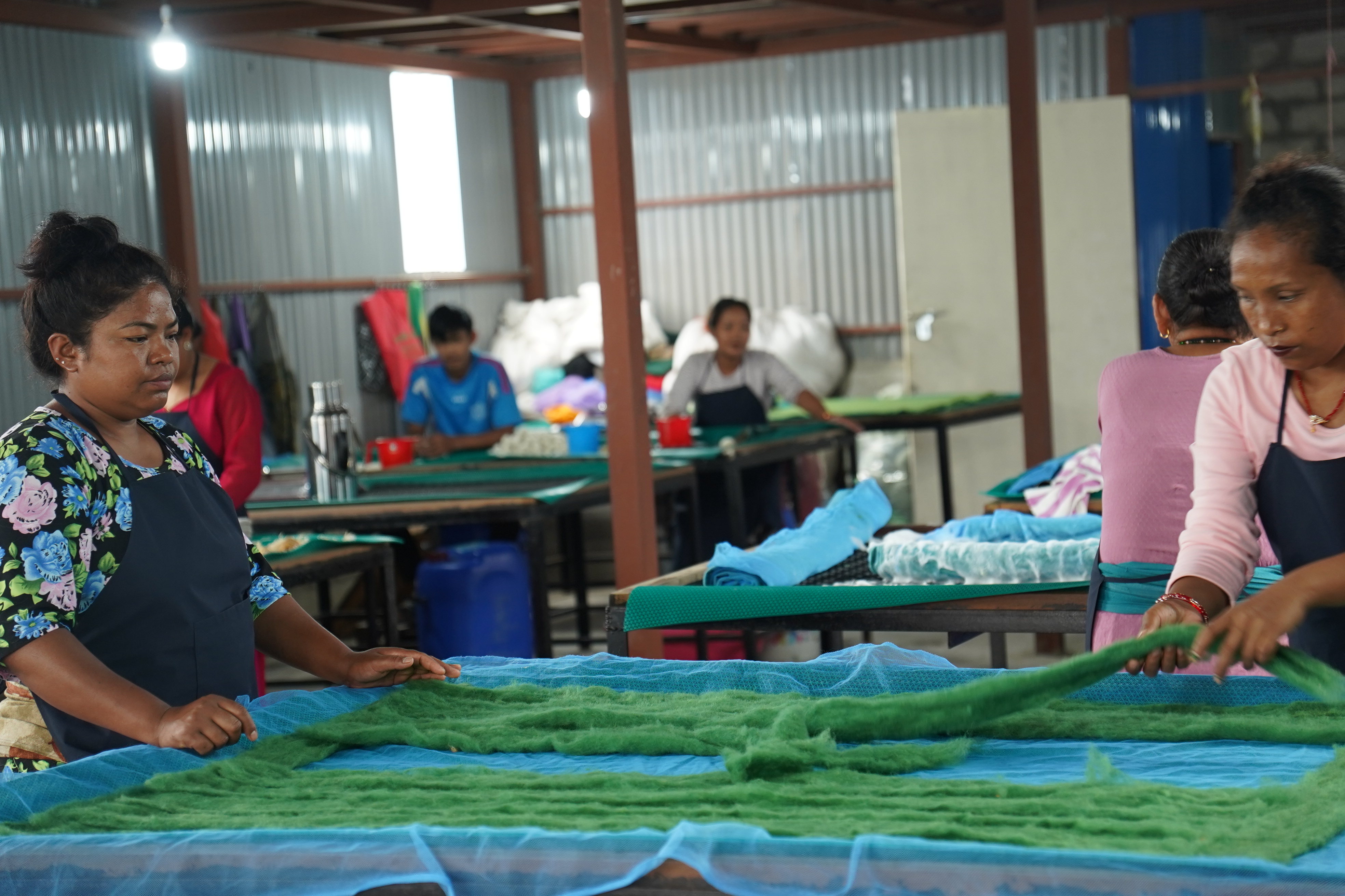 Skilled Nepali woman crafting handmade textile